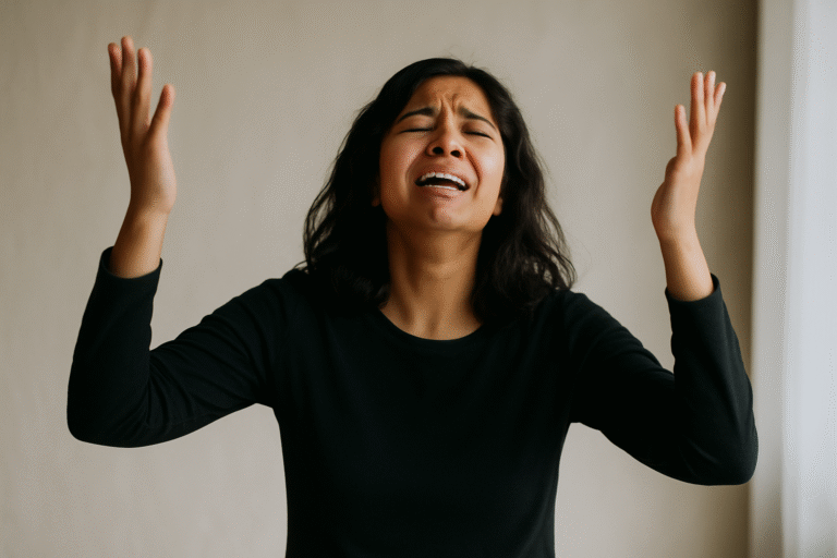 A woman crying out in repentance with her hands lifted, eyes closed, expressing deep emotion in a moment of prayer
